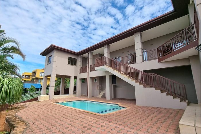 For Sale: Spacious 4-bedroom house with pool, balcony, and double garage in Ballito Central.