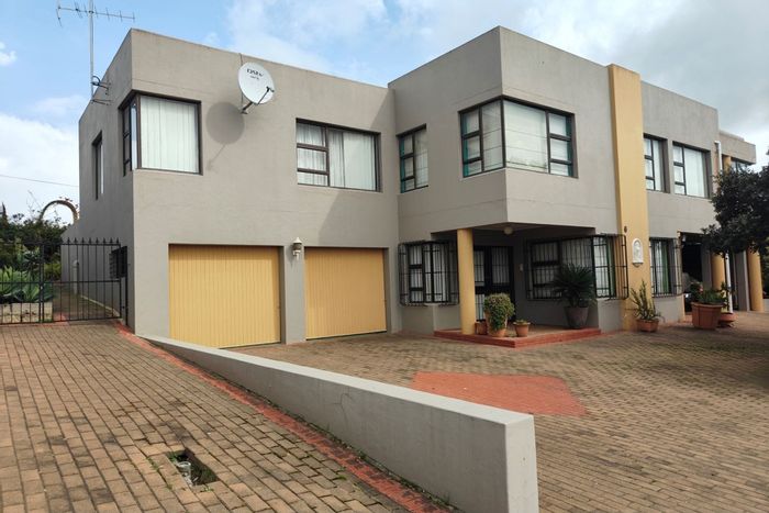 For Sale: Spacious 4-bedroom house in Moorreesburg Central with bachelor flat and ample parking.
