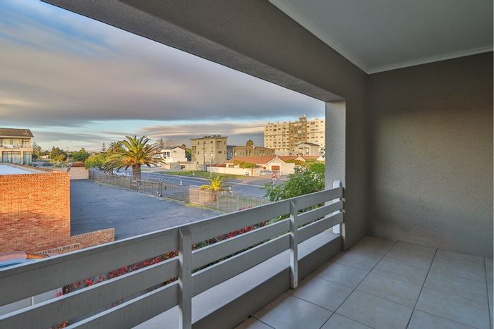 For Sale: Apartment in Bloubergrant with double carport, private balcony, and low overheads.