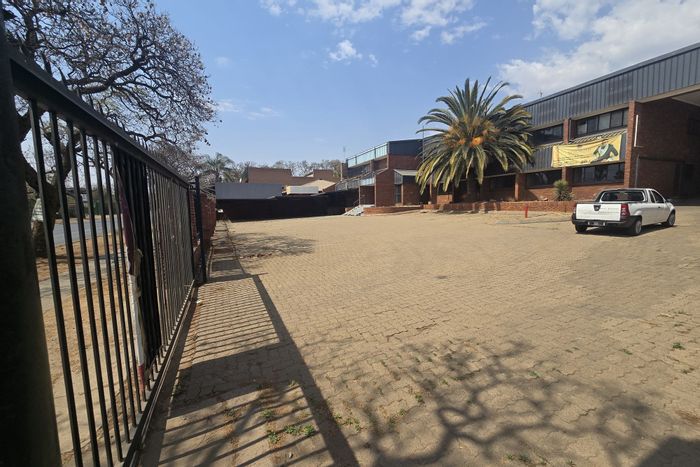 Versatile commercial property in Pretoria West with ample parking and event halls. For Sale.