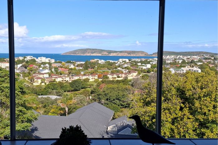 Lower Robberg House For Sale: Ocean views, sunroom, garden, and guest suite.