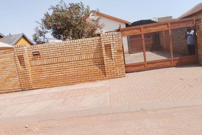 Two-bedroom house for sale in Protea Glen with garage and open lounge.