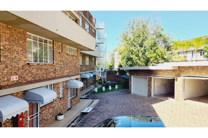 For Sale: Groenkloof Apartment with 3 bedrooms, garage, and fiber connectivity.