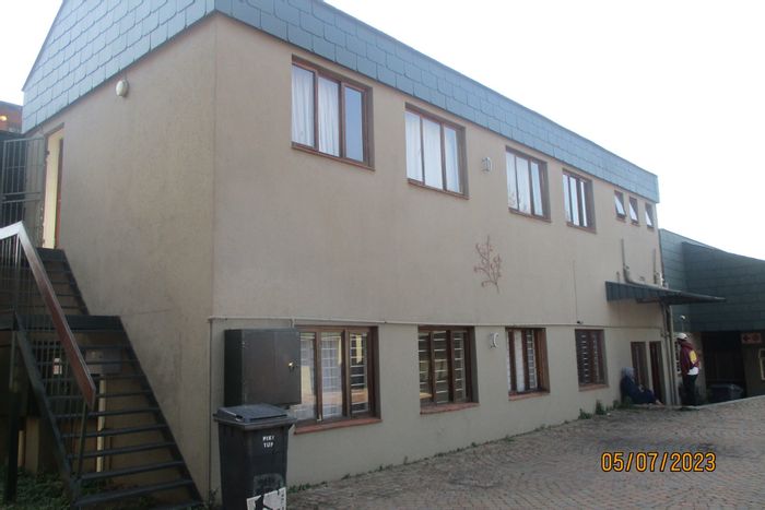 Braamfontein Werf Apartment For Sale: Tenant-occupied, spacious, with essential amenities.