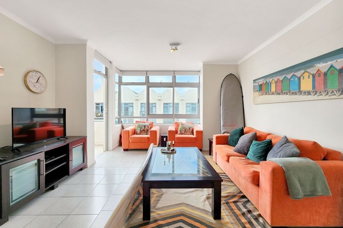 For Sale: Apartment in Muizenberg Central with beachfront access, security, and parking.