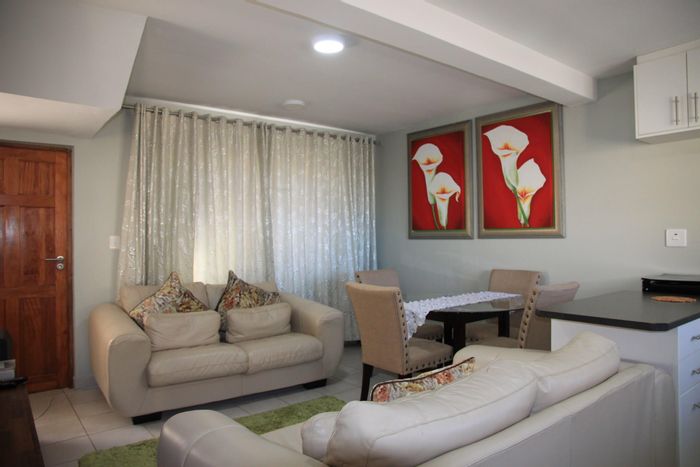 For Sale: Townhouse in Kidds Beach with security, garage, and ocean views.