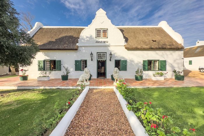 Paarl Rural Farm For Sale: 9-bedroom estate with event venue, guesthouse, and amenities.