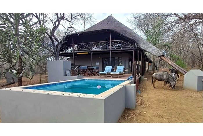 Marloth Park Central House For Sale: Spacious living, pool, bushveld views, adjacent plots available.