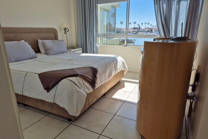 Waterfront Apartment for Sale in Port Owen with garage, braai area, and views.