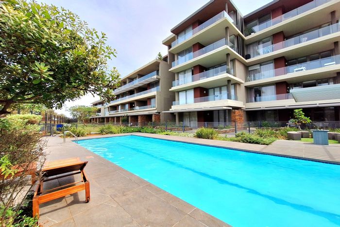 Sibaya Precinct Apartment For Sale: 2 beds, pools, playground, rooftop views, secure access.