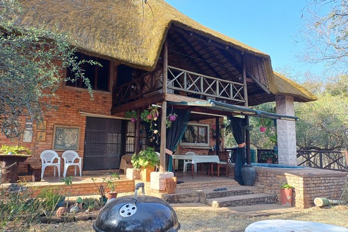House for Sale in Marloth Park Central: Pool, security, and spacious outdoor area.