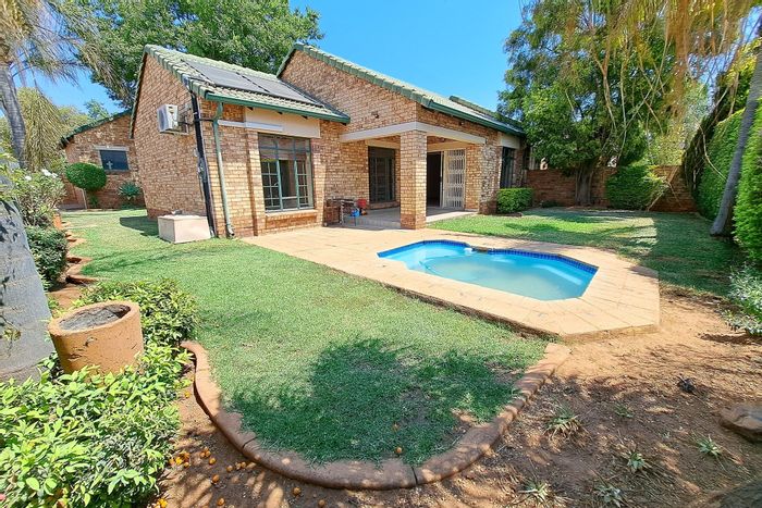 For Sale: Townhouse in Equestria with pool, security, and landscaped garden.