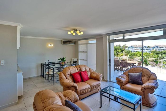 Ballito Central Apartment For Sale: Sea views, pools, courts, and secure garage.