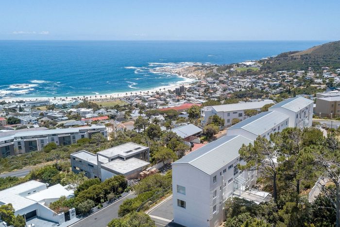 Camps Bay Apartment For Sale: Sea views, updated kitchen, covered parking, peaceful setting.