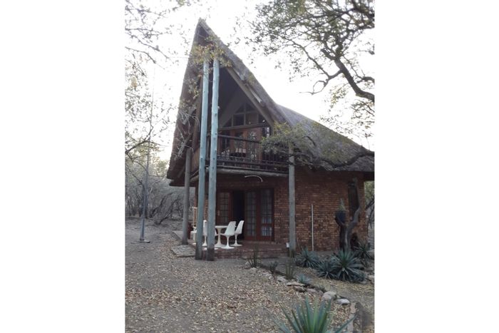 Cozy house in Marloth Park Central for sale, features boma and loft bedroom.