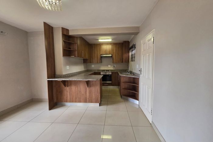 Duplex Apartment To Rent in Arboretum with spacious living, covered patio, and balcony.