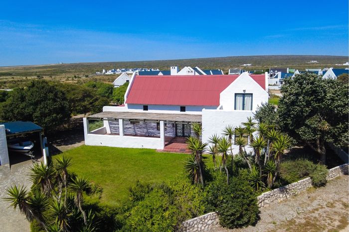 House for Sale in Jacobsbaai: Open-plan living, beach access, double garage, versatile room.