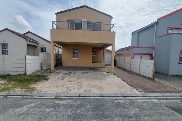 Spacious 4-bedroom house in Strandfontein with garage, balcony, and pet-friendly yard. For Sale.