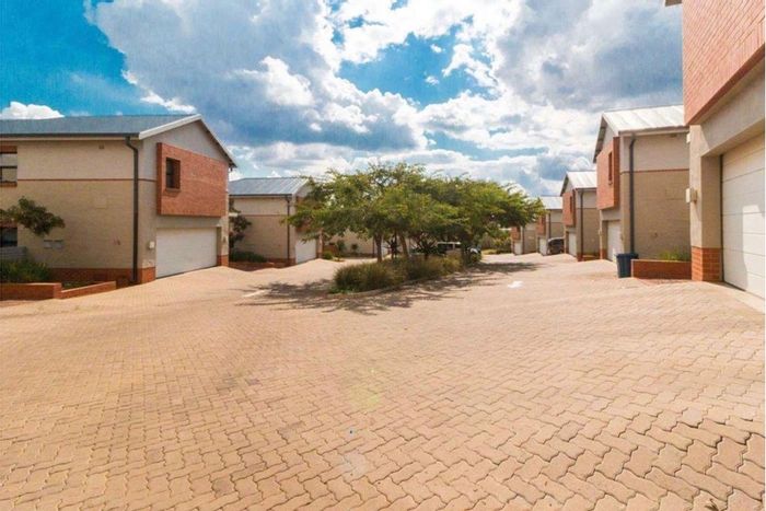 Townhouse To Rent in The Hills Game Reserve Estate with garden, garage, and amenities.