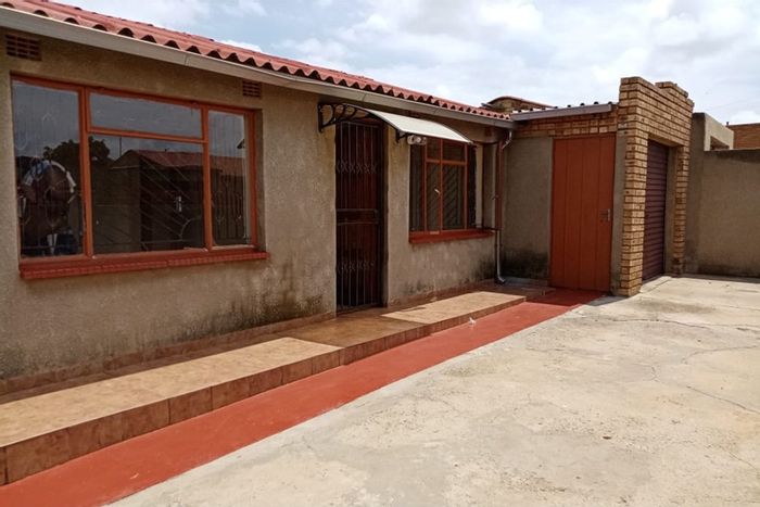 For Sale: Moletsane House with 2 Bedrooms, Garage, and Income Potential.