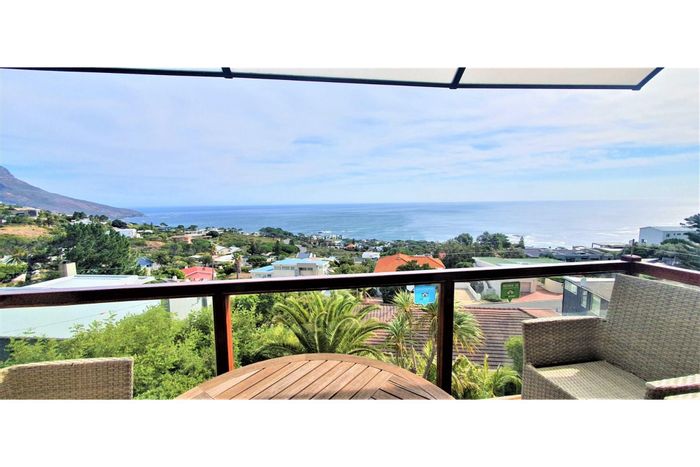 Camps Bay Apartment To Rent: Ocean views, private terrace, pool, and secure garage.