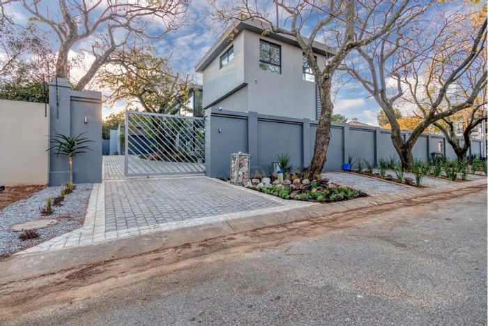 For Sale: House in Bryanston East with spacious yard, security, and eco-friendly features.