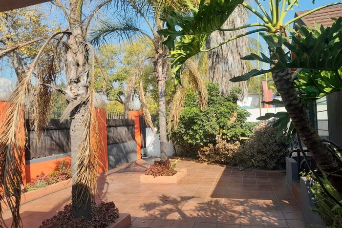 House To Rent in Pretoria West: 4 rooms, reception area, large yard, parking.