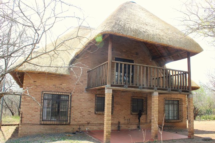 House for Sale in Marloth Park Central: 2 beds, 2 baths, borders parkland.