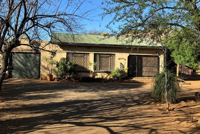 House for Sale in Groot Marico Central: 3 bedrooms, large garden, investment potential.