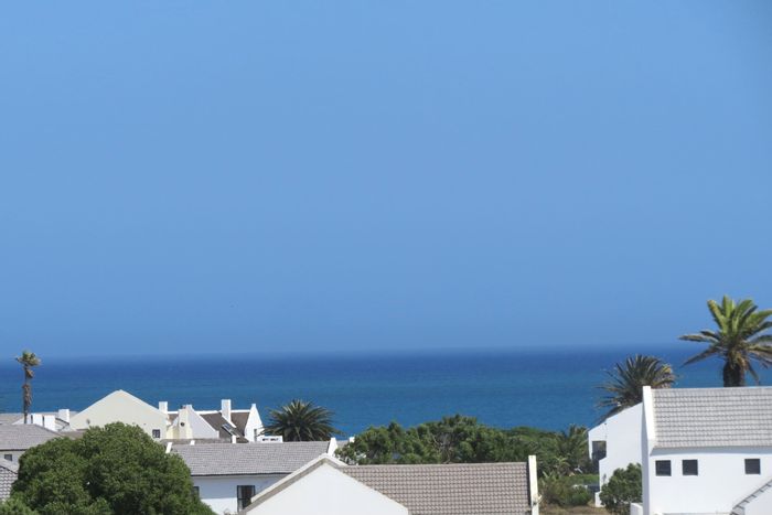 For Sale: House in Golden Mile with golf course views, double garage, and outdoor shower.