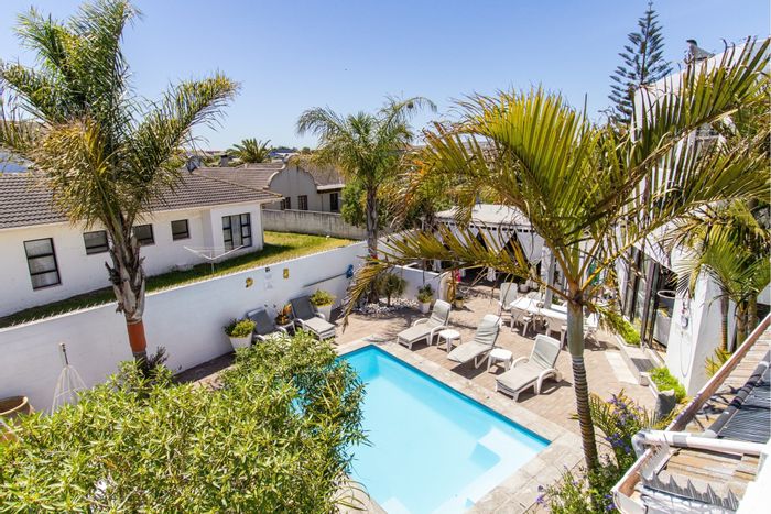 For Sale: House in Country Club with guesthouse potential, pool, and generator backup.