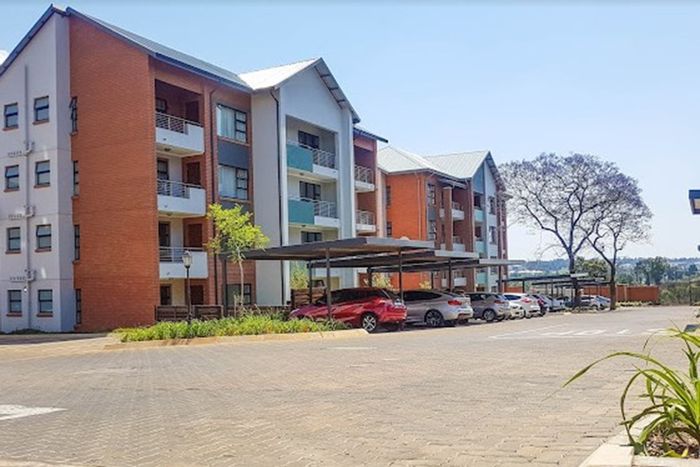 For Sale: Apartment in Modderfontein with security, pool, clubhouse, and gardens.