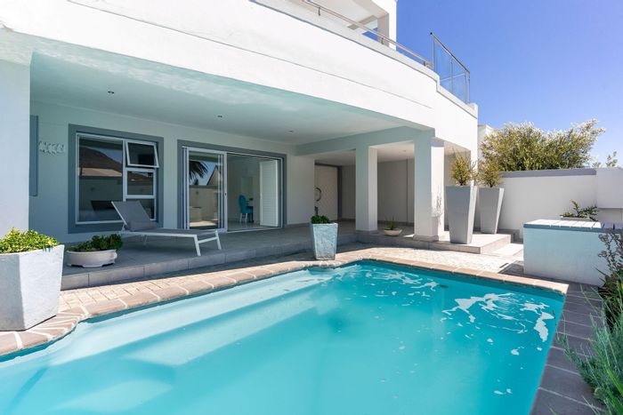 Camps Bay Townhouse For Sale: 4 bedrooms, pool, ocean views, ideal Airbnb investment.