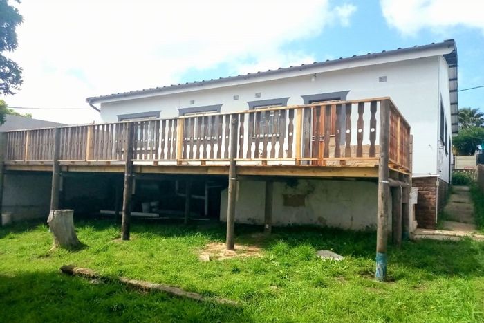 For Sale: House in Albertinia Central with 3 bedrooms, garage, and wooden deck.