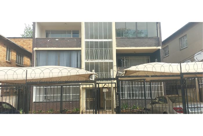 Charming Bellevue apartment for sale: 2 beds, garage, balcony, renovation potential.