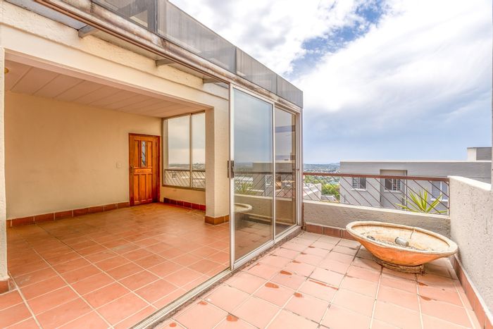 For Sale: Spacious Constantia Kloof Apartment with panoramic views, garage, and parking.