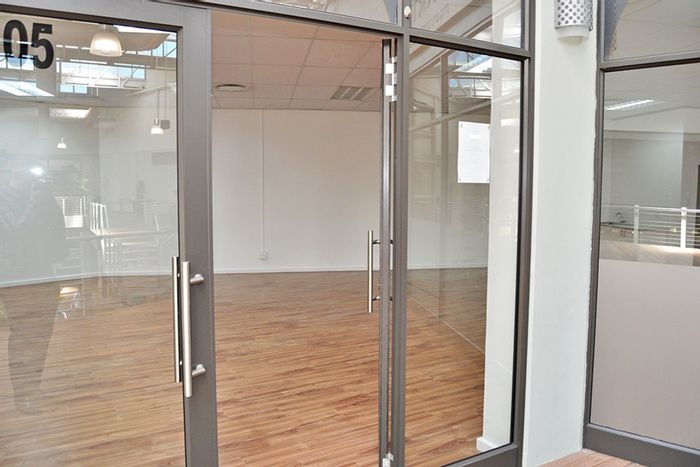 Office To Rent in Milnerton Central: Prime location, kitchenette, air-conditioning, and safety features.