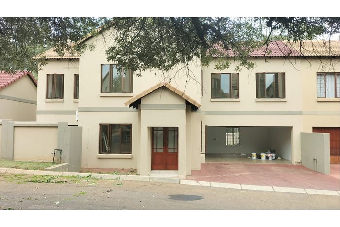 House To Rent in Olympus AH: Secure estate, spacious living, four bedrooms, ideal for families.