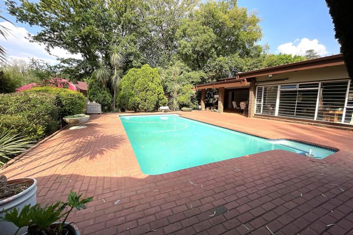 For Sale: Spacious Henley On Klip house with pool, cottage, and expansive gardens.