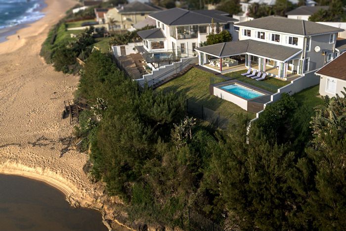 Beachfront house in Salt Rock for sale with direct beach access and ocean views.