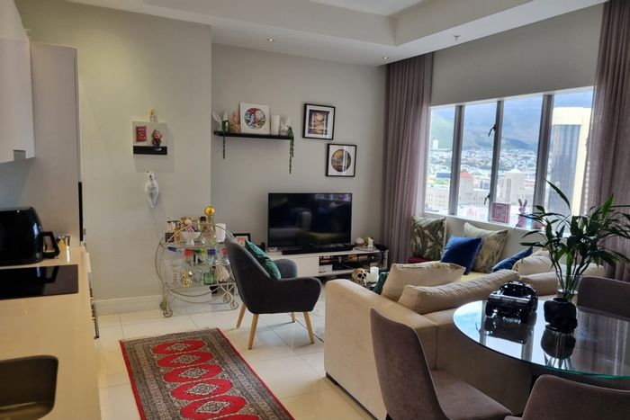 For Sale: Apartment in Cape Town City Centre with gym, pool, parking, and rental options.