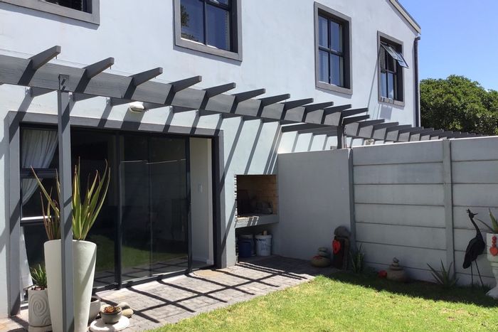 For Sale: Vredenburg Central Townhouse with garden, garage, and gated estate access.