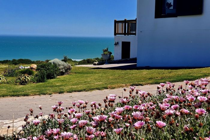 Fynbosstrand House For Sale: Eco-friendly, sea views, private estate access, outdoor spaces.