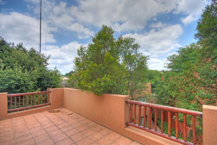 For Sale: Apartment in Douglasdale with clubhouse, pools, and tennis court amenities.