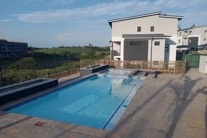 1-Bedroom Apartment To Rent in Ballito Commercial District with pool, gym, and parking.