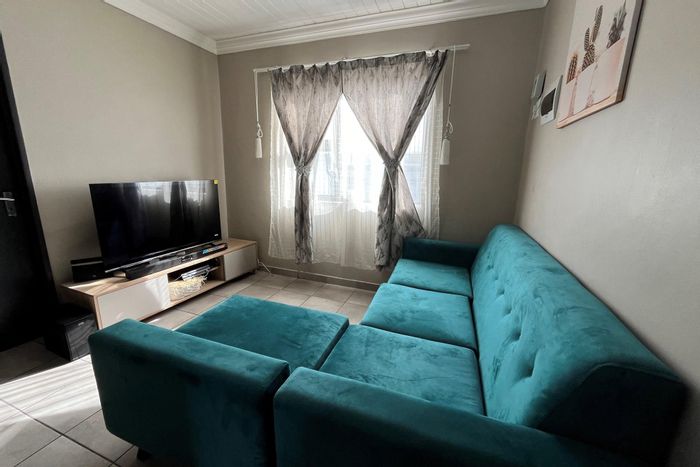 North-facing Belhar apartment for sale: 2 beds, secure parking, access control.