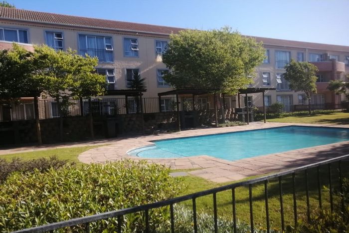 Ground floor apartment in Pinelands with security, amenities, and nearby hospitals. For Sale.