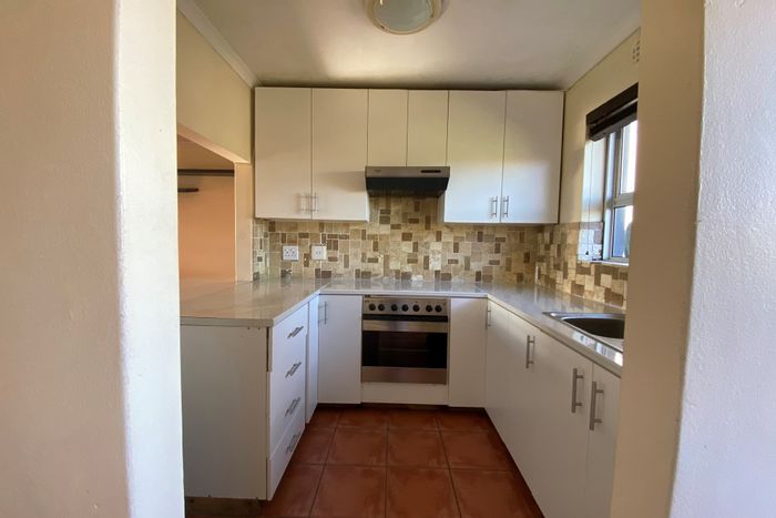 Ottery Apartment For Sale: Two bedrooms, renovated kitchen, communal washing lines, potential upgrades.