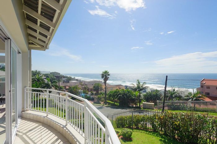 Beachfront apartment in Shakas Rock to rent: pool, garage, and security features.