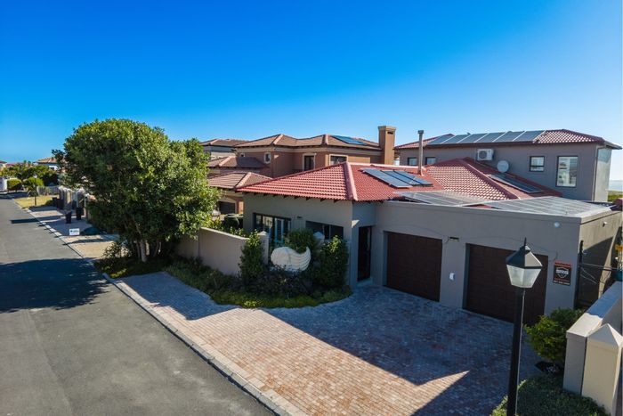 For Sale: House in Big Bay with ocean views, pool, and energy-efficient features.